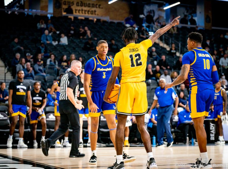 LBSU's Jadon Jones promptly points to the scoreboard as he's told he's too small.
