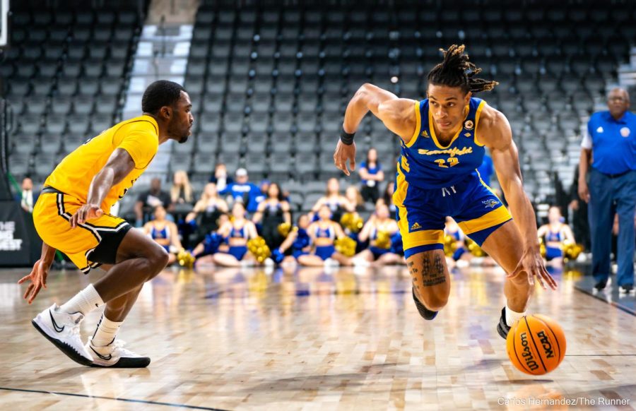 Justin McCall drives against Long Beach State's stifling defense.
