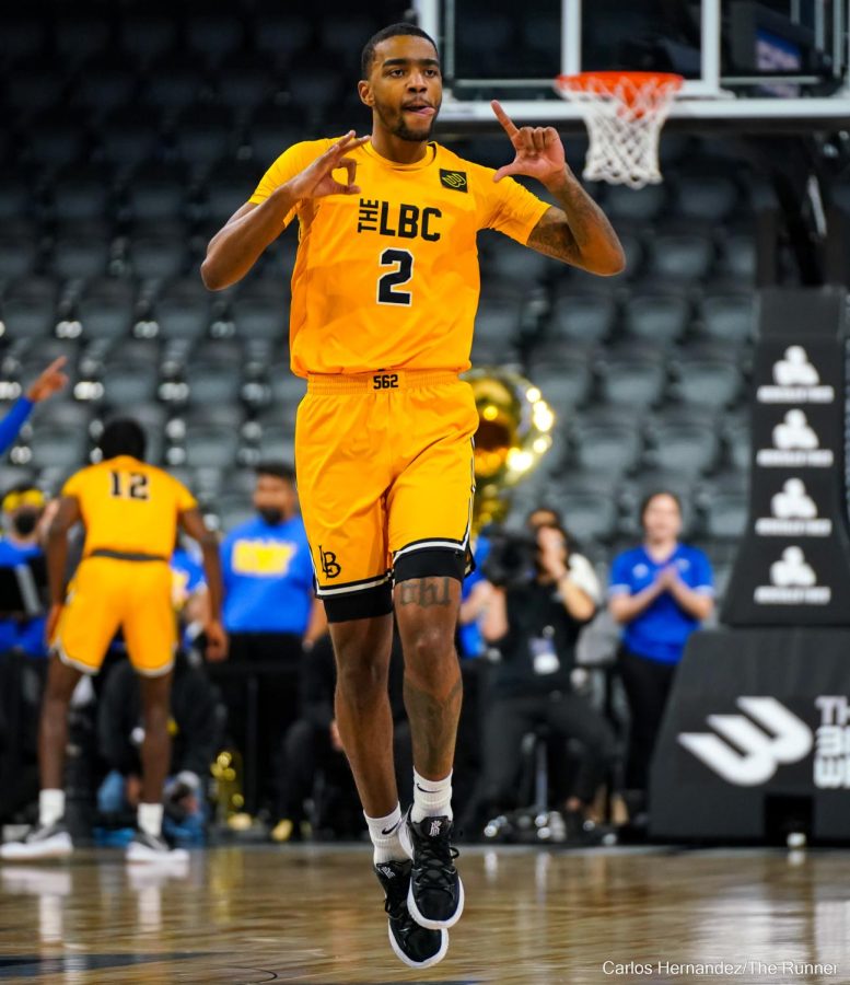Bakersfield, CA native Jordan Roberts represents Long Beach with their signature hand sign.

