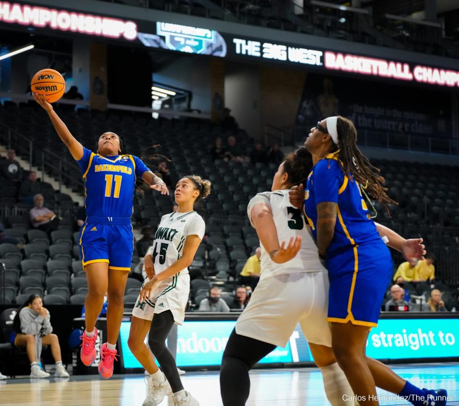 CSUB's Lexus Green beats Hawaii's OLIVIA DAVIES off the dribble for a layup at the basket.
