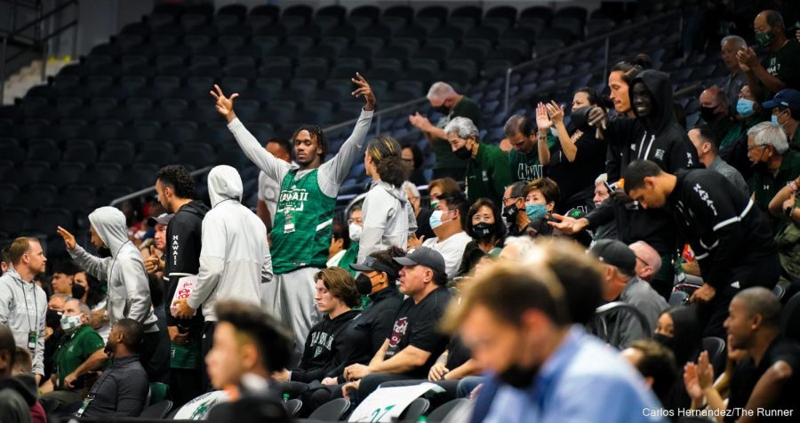 Hawaii Men's Basketball forward roots on the Women's basketball team in their game against CSUB.
