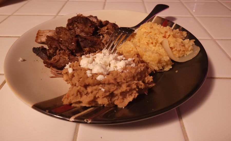 Plated carnitas dish with rice