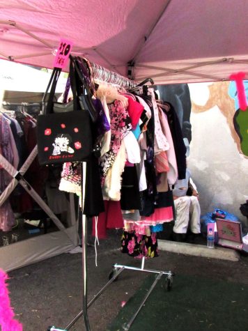 A $10 items rack stocked with vintage dresses and shirts.