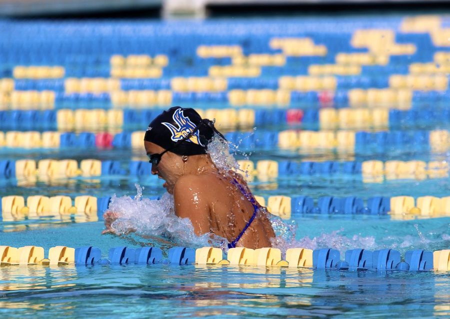 Chelaine Van der Westhuizen swimming the breaststroke for the 200 yard medley relay in which the Runners took first against Pomona-Pitzer at the Hillman Aquatic Center on Saturday, Oct. 22, 2022.