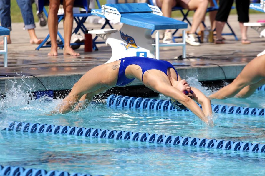 Jessica Franco wins the 100 yard backstroke with a time of 59.76 besting her previous times from last season on Saturday, Oct. 22, 2022 at the Hillman Aquatic Center. 