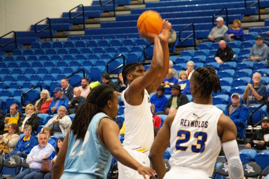Ivan Reynolds (#23) shoots for a point against San Diego Christian College on November 7, 2022. 