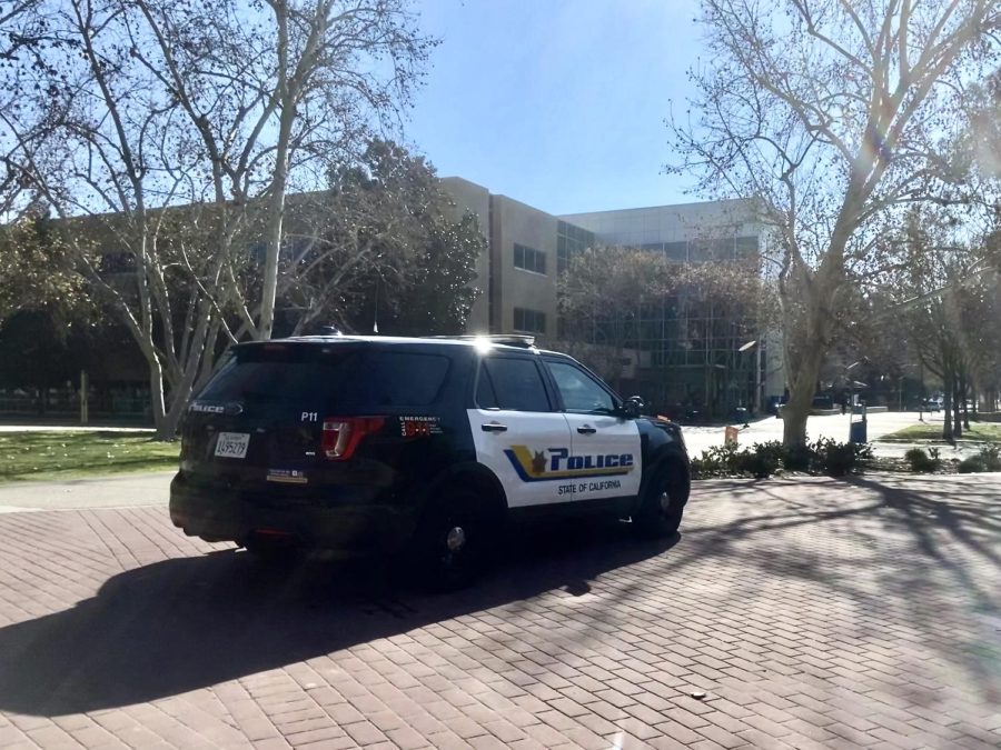 University Police vehicle parked between Romberg Nursing building and Science I on Jan. 31, 2023. Photo by Haydee Barahona / The Runner