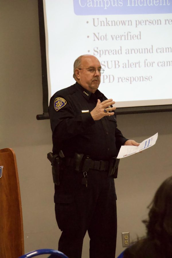 Chief Marty Williamson debriefing faculty and staff about the incident regarding an armed individual on campus. Photo by Jocylnne Landon / The Runner 