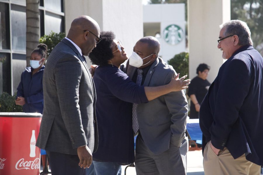 EJ Callahan, Assistant Vice President for Student Affairs and Student Centered Enterprises inc., hugging Tamar Anthony, Co Chair for the Black Faculty and Staff Association at the black history kick off celebration. Photo by Jocylnne Landon/ The Runner