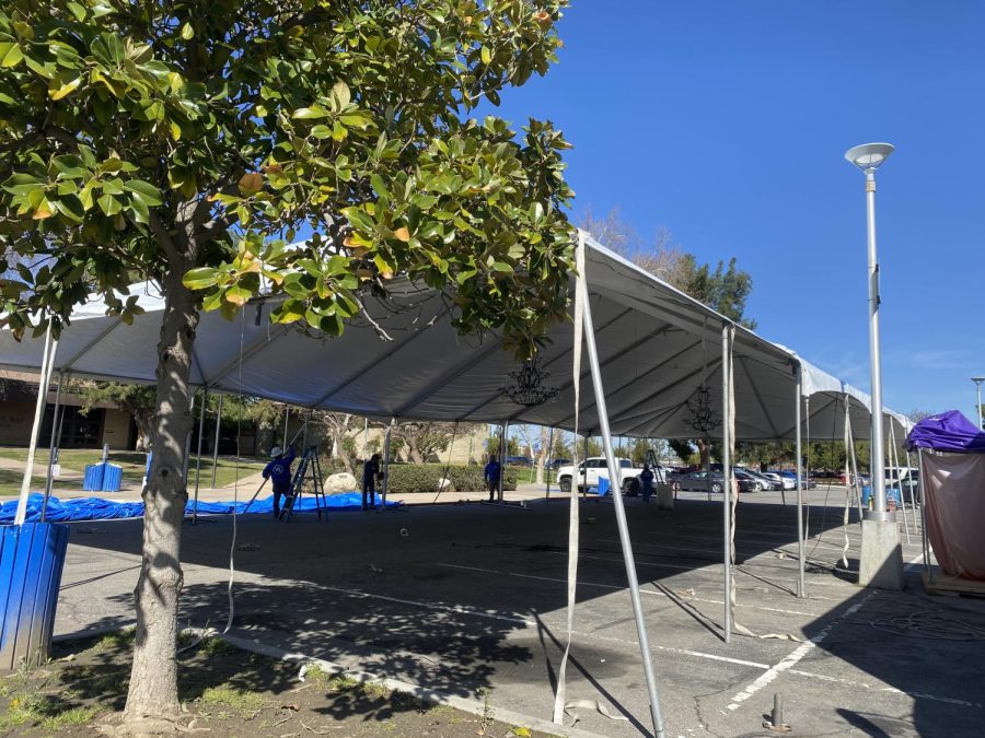 Tent being set up in front of the Doré Theatre, parking lot C by Kristen McGuire / The Runner