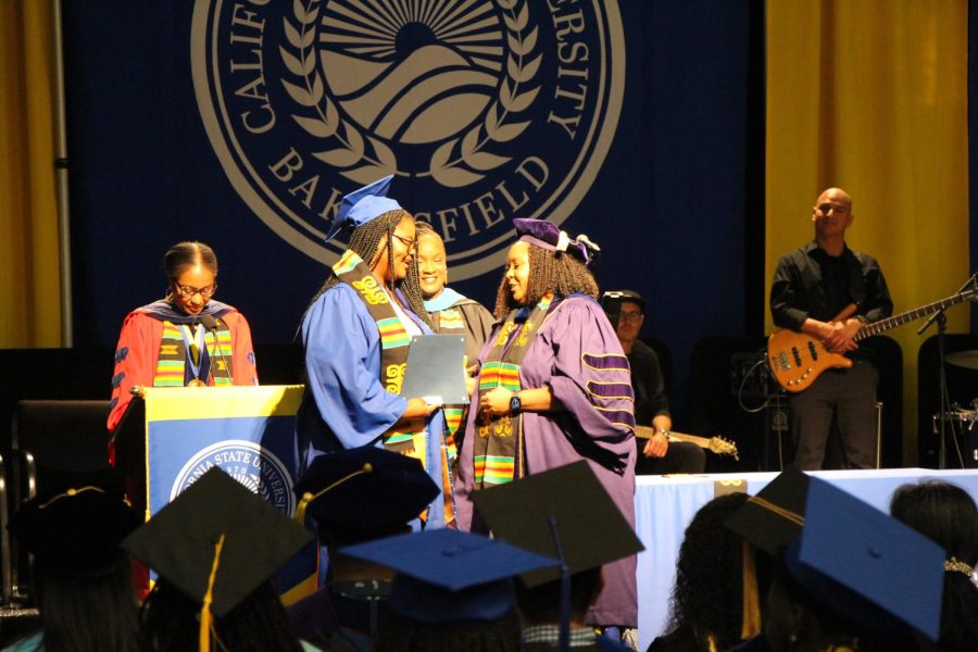Uchechi Okey-Dike accepts her award during the Black Graduates Recognition Ceremony on May 13, 2023. 