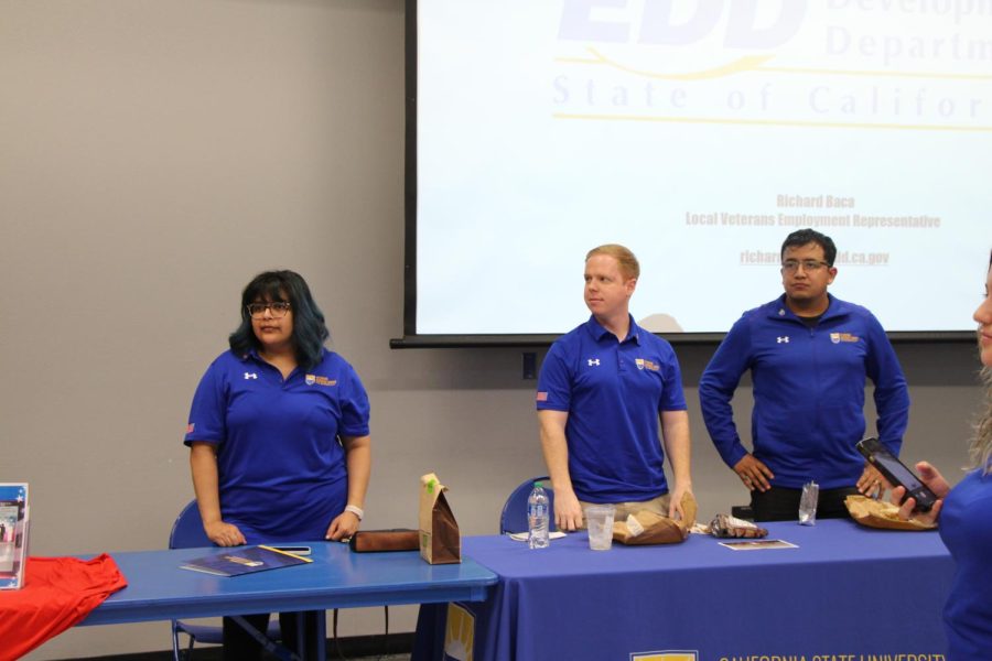 Liz Wood and her colleagues stand in recognition of the work they've done in creating the Veterans Networking Symposium event on April 26. 2023.