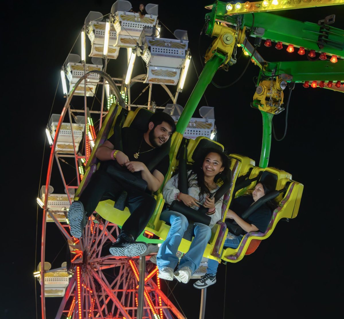 Hector Mendoza (left) and Camila Jaimes (right) smile with glee as they are spun around on “Viper”. 