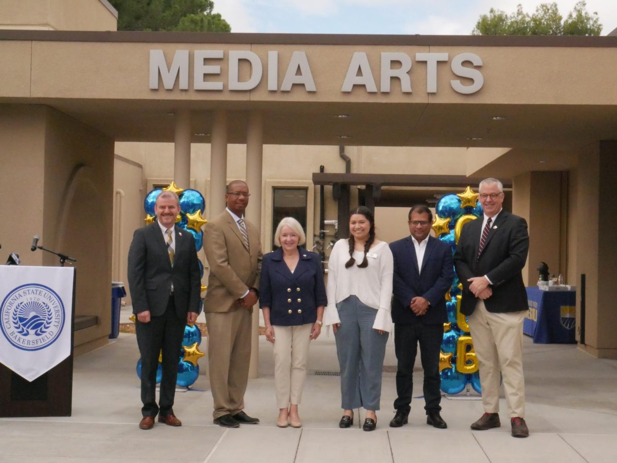 Members of the President's Cabinet and School of Arts and Humanities stand in front of the new Media Art building moments after the ribbon cutting. Photo by Jennifer Serrano Ramirez / The Runner