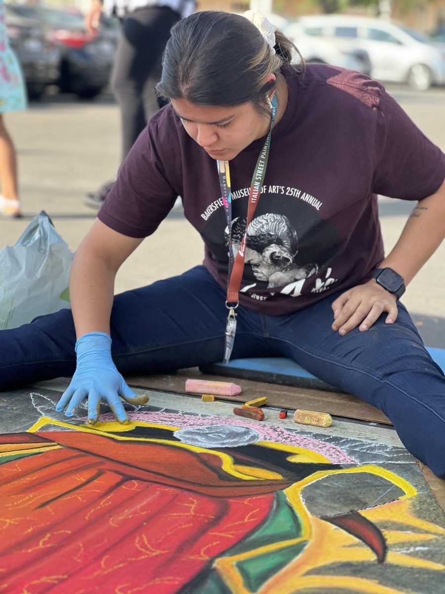 Almaguer blending in the chalk for her Virgin Mary piece at Via Arte. 