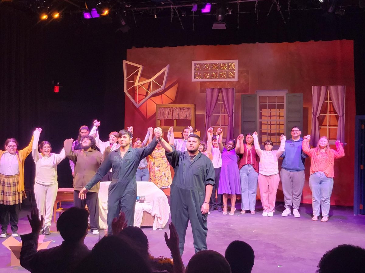 The entire cast of “Theater of New Voices,” hold hands to demonstrate a team effort as they take a bow to thank the audience for attending.