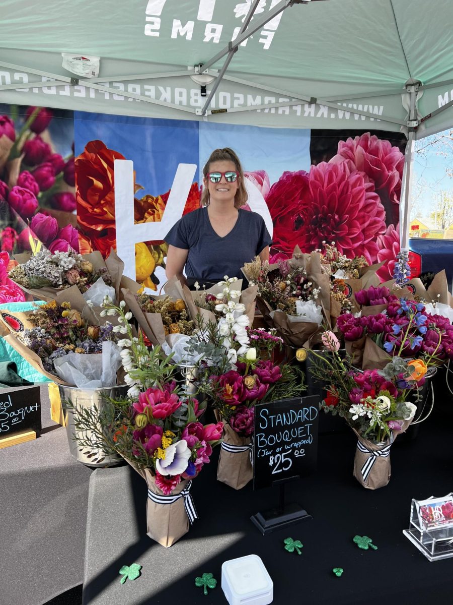 Kathleen Armstrong sets up her flower production business, KR Farms. Photo by Izabella Gonzalez / The Runner