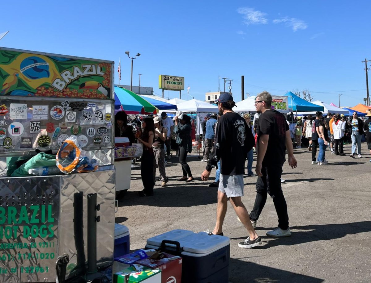 Shoppers walk through rows of food and clothing at the Kern County Vintage Flea in Bakersfield on March 17. Photo by Haydee Barahona