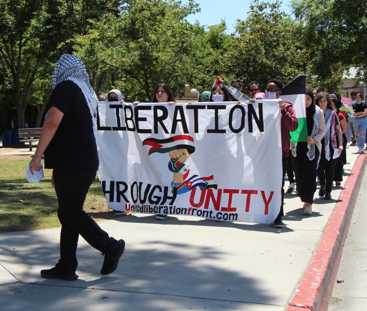 Cal State Bakersfield students and Bakersfield community marching at the Palestine solidarity peaceful protest  with flags and signs on May 8.