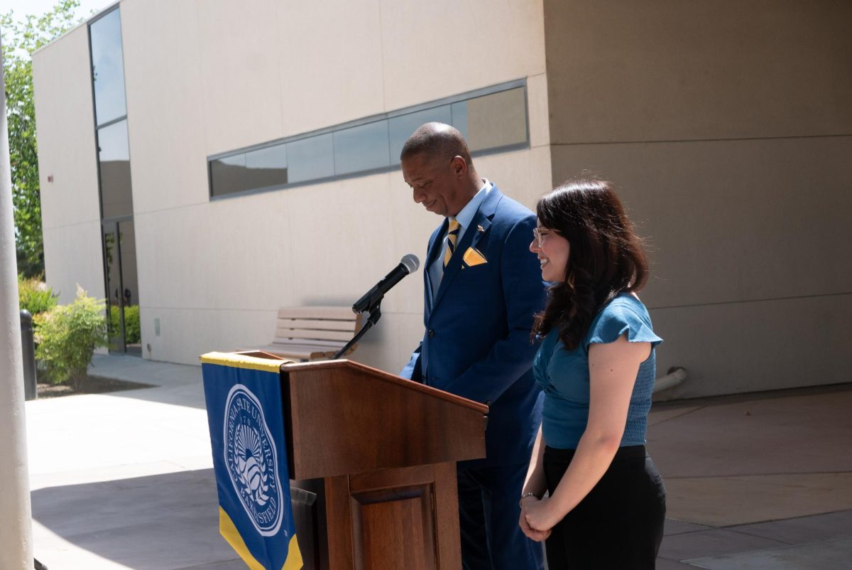 Haydee Barahona, communications major with a concentration in journalism, and Dr. Vernon Harper, interim President  of CSUB at the President's medal ceremony on May 13. 