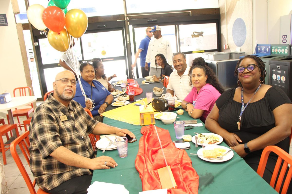  students, staff, and faculty enjoying the food at the Soul Food Thursday Luncheon