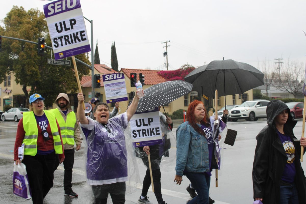 Women shouting out loud and marching in protest of the Service Employees International Union cutbacks. 