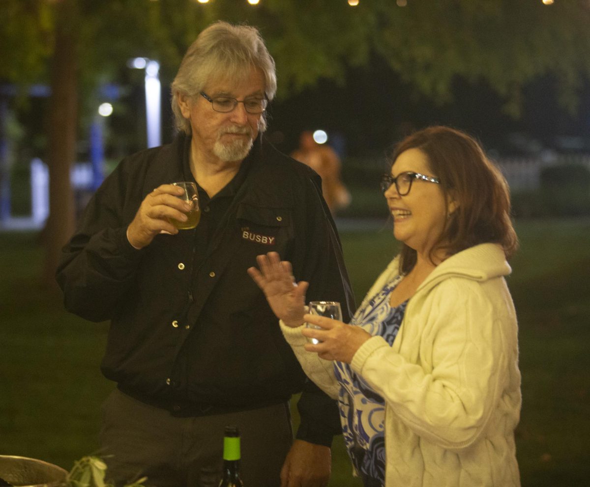 People try white wine from Campo Wine Bar at the Sip and Scholarship event on Friday March 31. 