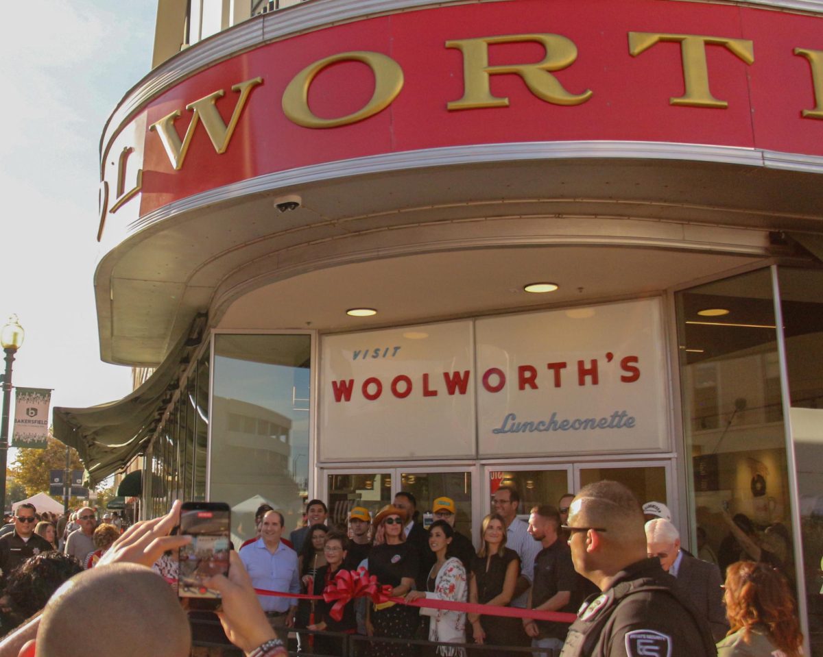 Ribbon cutting ceremony at the Woolworth's grand opening. Photo by Fatima Salais / The Runner