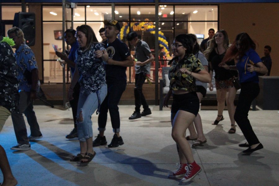 A group of students dance during the last hour of the Runner Luau on Tuesday, Sept. 3. 